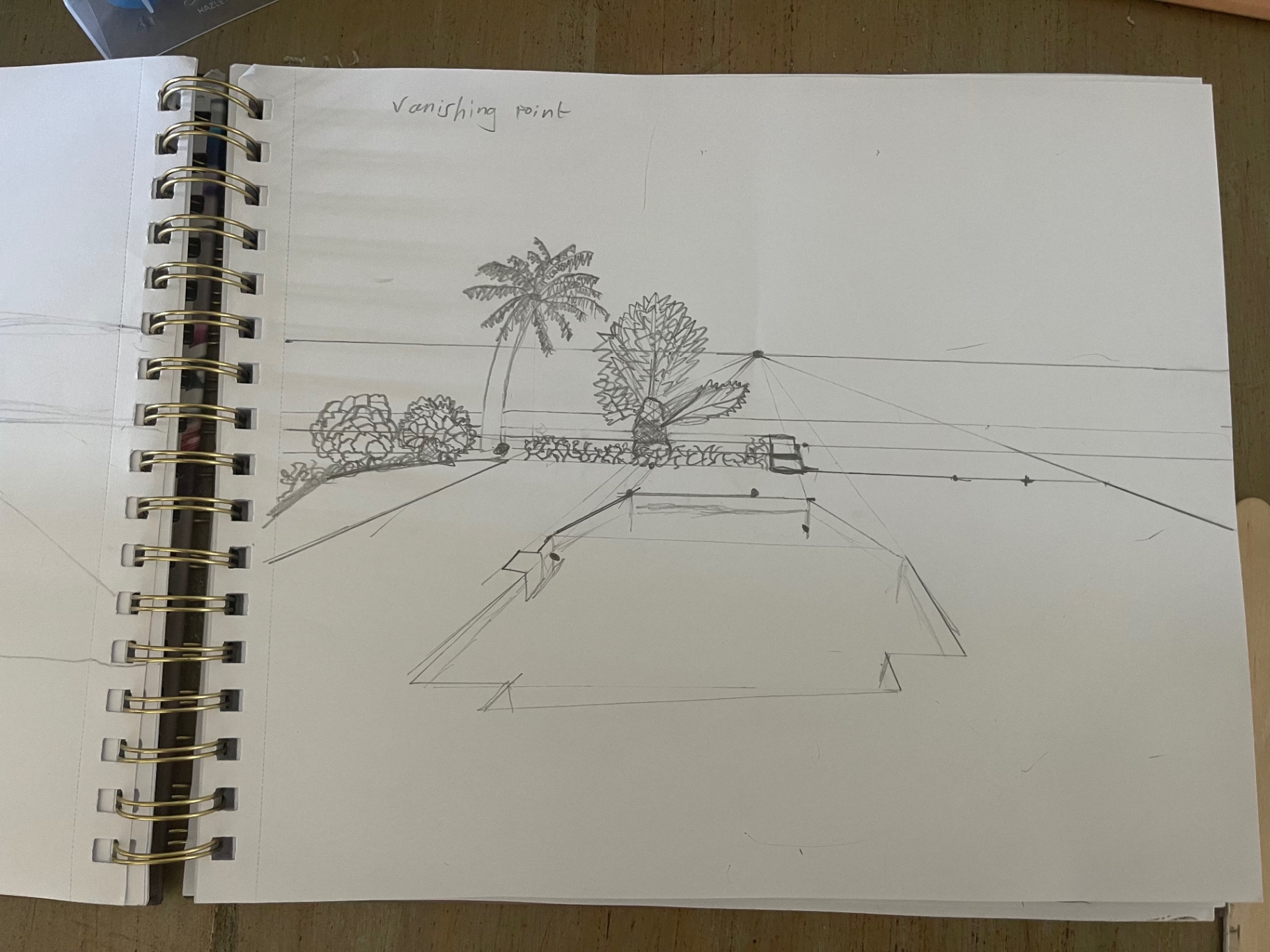 Sketchbook page studying one-point perspective and a vanishing point