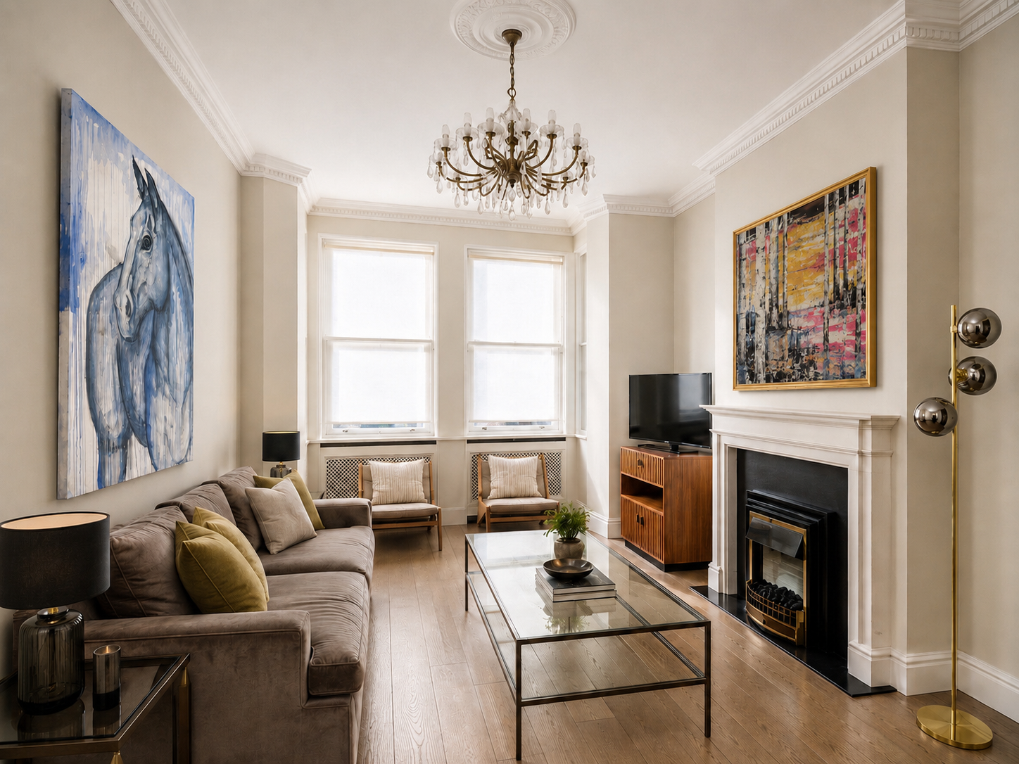 A London sitting room with a blue horse painting and a colourful abstract above the fireplace