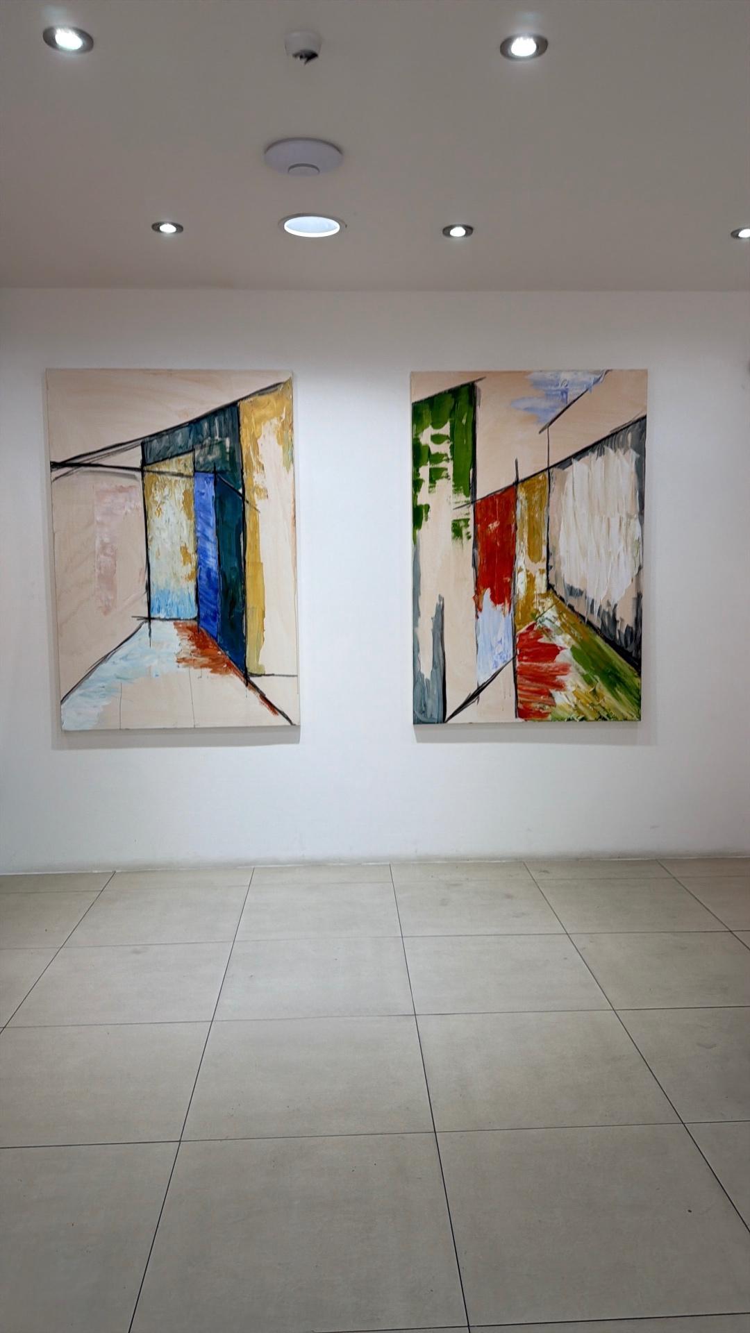 A wall at Easy Hub, Chelsea, with a pair of hung canvases