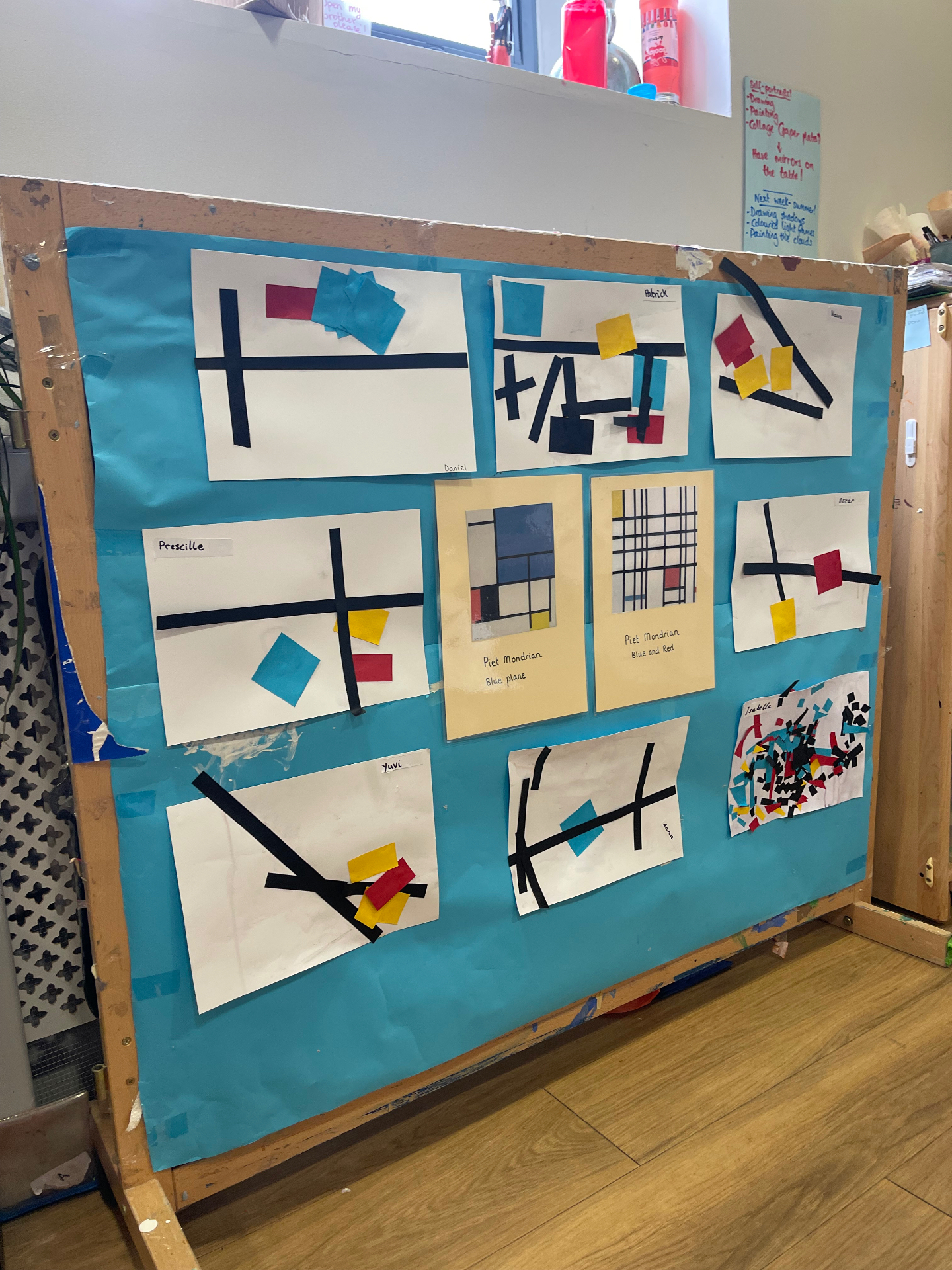 Classroom display of children's Mondrian-inspired collages